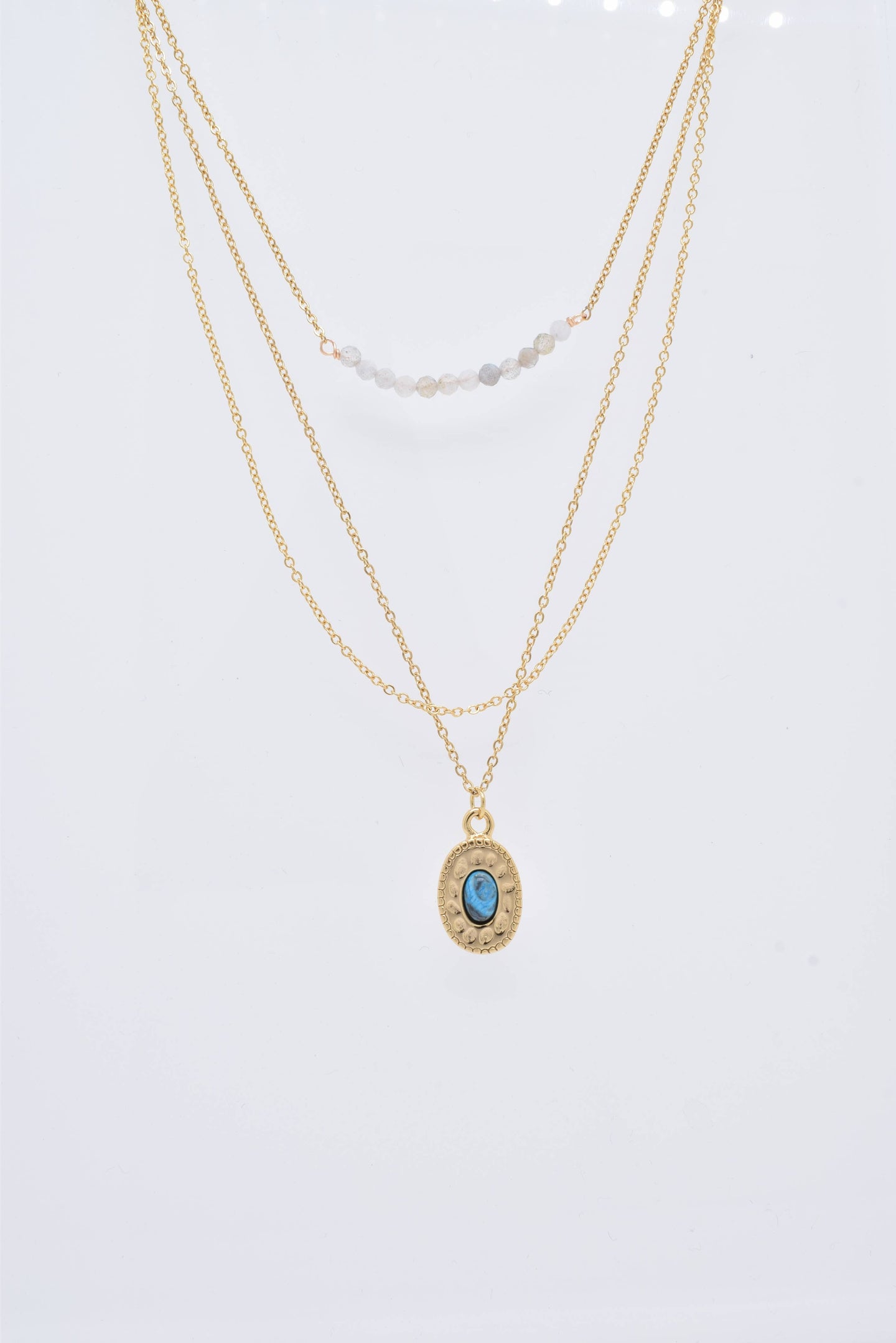 Three-row gold steel necklace with stones